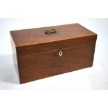 A Georgian mahogany tea caddy with boxwood edges and bone keyhole escutcheon,