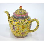 A Chinese yellow ground, famille rose teapot with domed cover and knop finial,