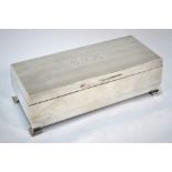 A good quality engine-turned silver cigarette box,