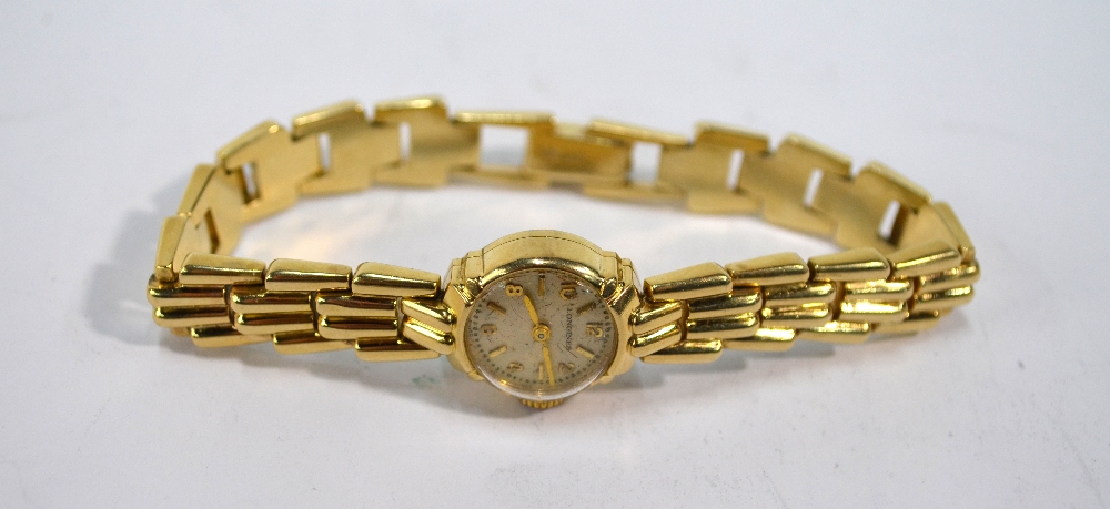 A lady's 14k Longines wristwatch, 17 jewel movement with 15 mm silvered dial,