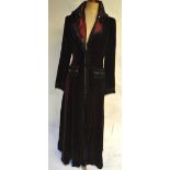A Gothic style deep red velvet evening coat lined in shot silk effect fabric and embellished with