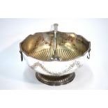 A large electroplated on copper punch bowl with lion mask and ring handles,