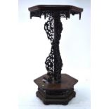 An antique Chinese wood stand of hexagonal form;