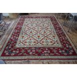 A Turkish Lal carpet, the camel ground with linked vine design,