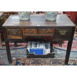 An antique Chinese calamander desk, the rectangular top over an arrangement of four drawers,