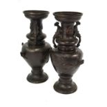 A pair of Japanese bronze vases; each one with trumpet neck,
