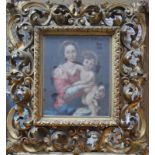 An Italianate giltwood frame in the rococo manner with scroll and foliate detail,