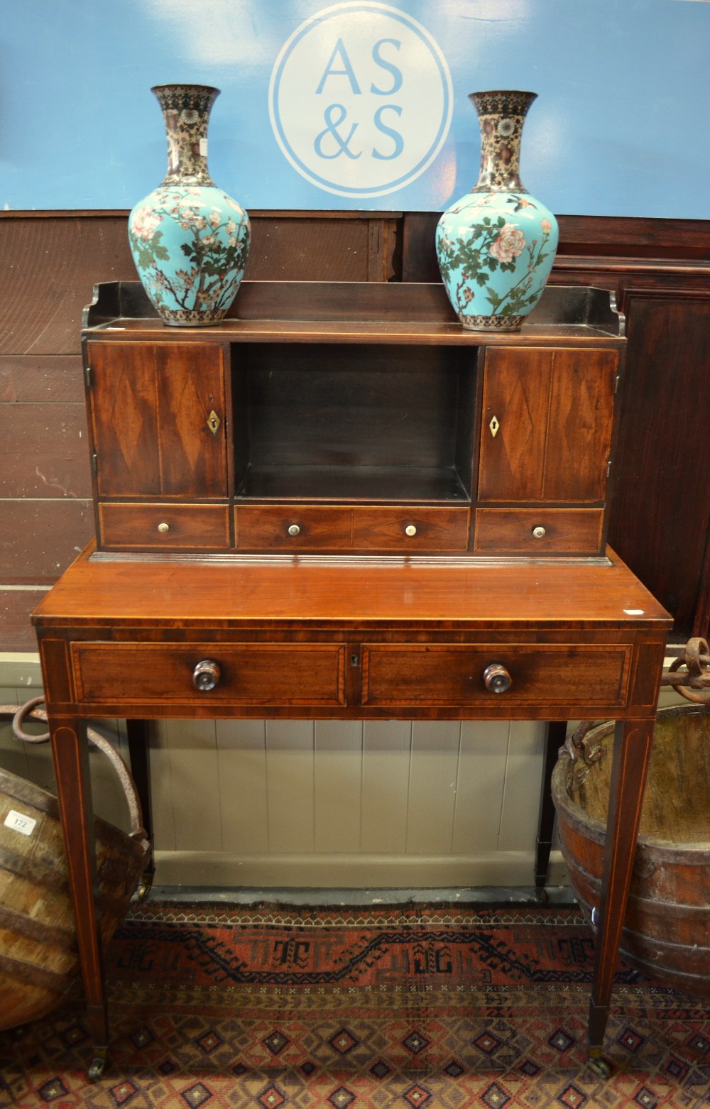 A 19th century cross-banded and diamond inlaid mahogany writing table in bonheur de jour style,