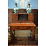 A 19th century cross-banded and diamond inlaid mahogany writing table in bonheur de jour style,