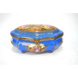 A Sevres porcelain shaped casket decorated with printed and painted vignettes of lovers in pastoral