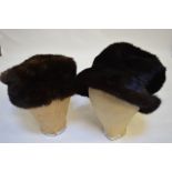 A dark brown mink pull-on hat with adjustable rim,