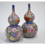 A pair of famille rose vases of double gourd form;