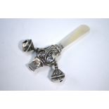 A baby's silver rattle with whistle, bells and mother of pearl handle/teether,