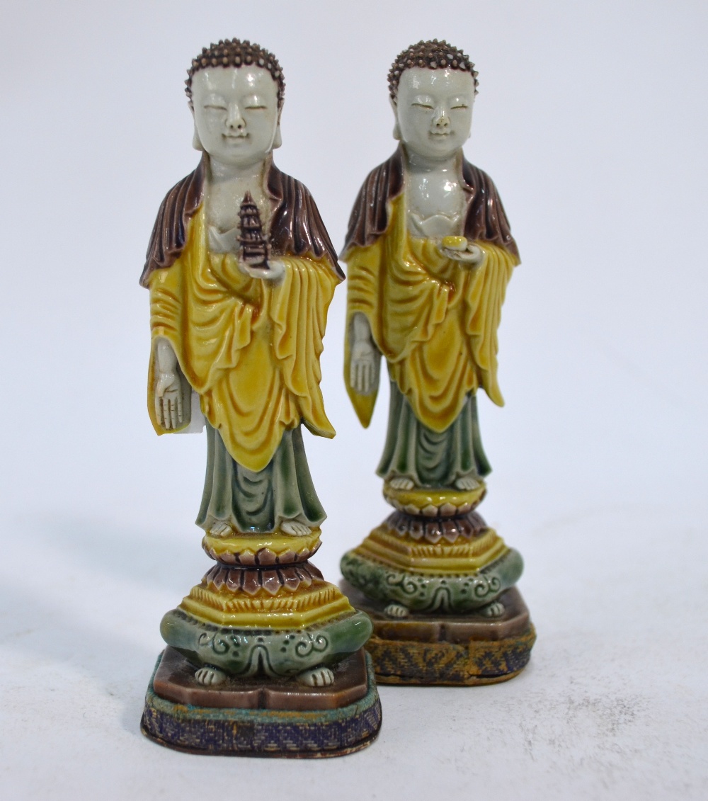 A Chinese associated pair of egg and spinach standing figures of Amitayus or Sakyamuni;