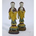 A Chinese associated pair of egg and spinach standing figures of Amitayus or Sakyamuni;