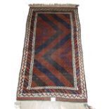An old Afghan Mushwani Baluch rug circa 1900,