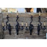 A set of eight large ormolu twin scroll arm wall sconces in the high Regency style,
