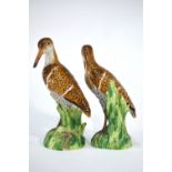 A pair of 19th century Berlin porcelain models of snipe, underglaze blue factory mark to base, 19.