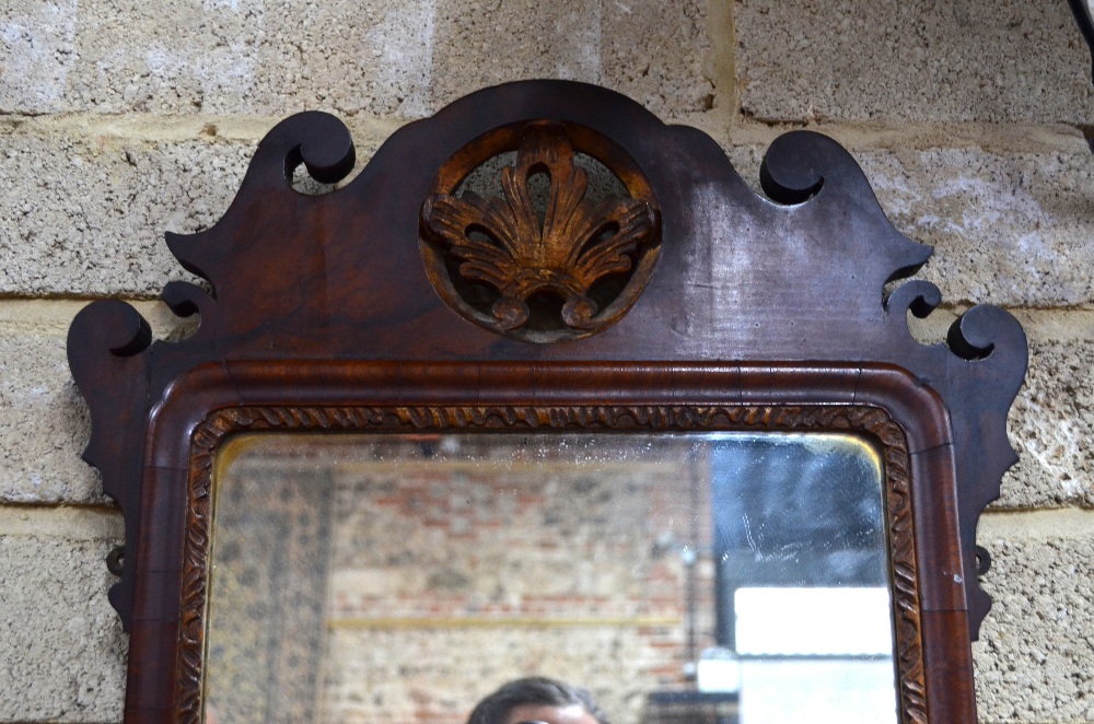 A 19th century parcel gilt fret cut mahogany mirror, centred with a gilt detail crest, - Image 2 of 3