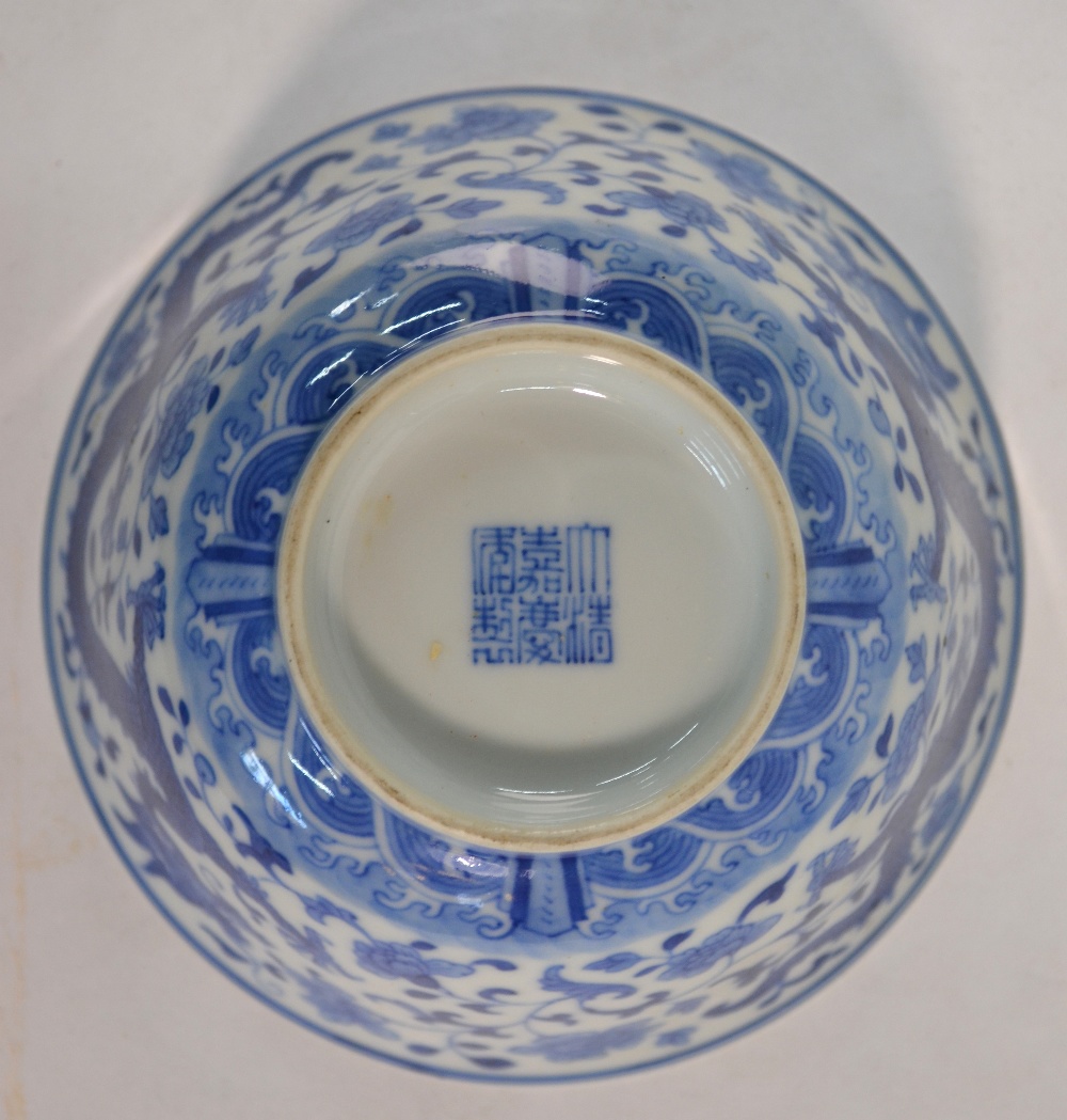 A Chinese set of three blue and white bowls; - Image 5 of 5