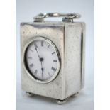 A Mappin & Webb silver boudoir clock with 'spots and stripes' engraved case,