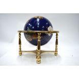 A blue enamelled table globe, inset with wire cloissonnes, polished hardstones and mother-of-pearl,