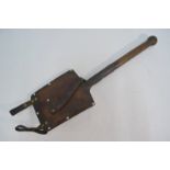 A WW2 Swiss Army trenching spade with riveted blade and turned wood handle,