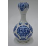 A blue and white vase with waisted neck, decorated on the oviform body with taotie-style motifs,
