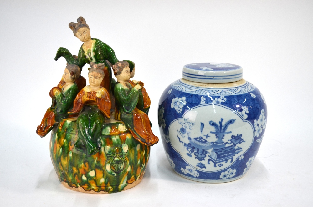 A Chinese blue and white oviform vase and cover, decorated with panels of scholar's implements,