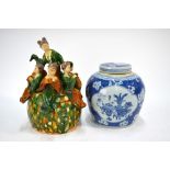 A Chinese blue and white oviform vase and cover, decorated with panels of scholar's implements,