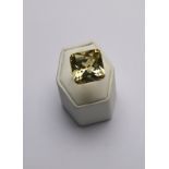 A square cut pale citrine cocktail ring in yellow metal setting,