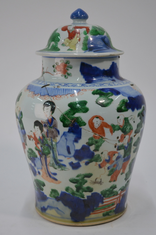 A Chinese Wucai oviform vase with domed cover and knop finial;