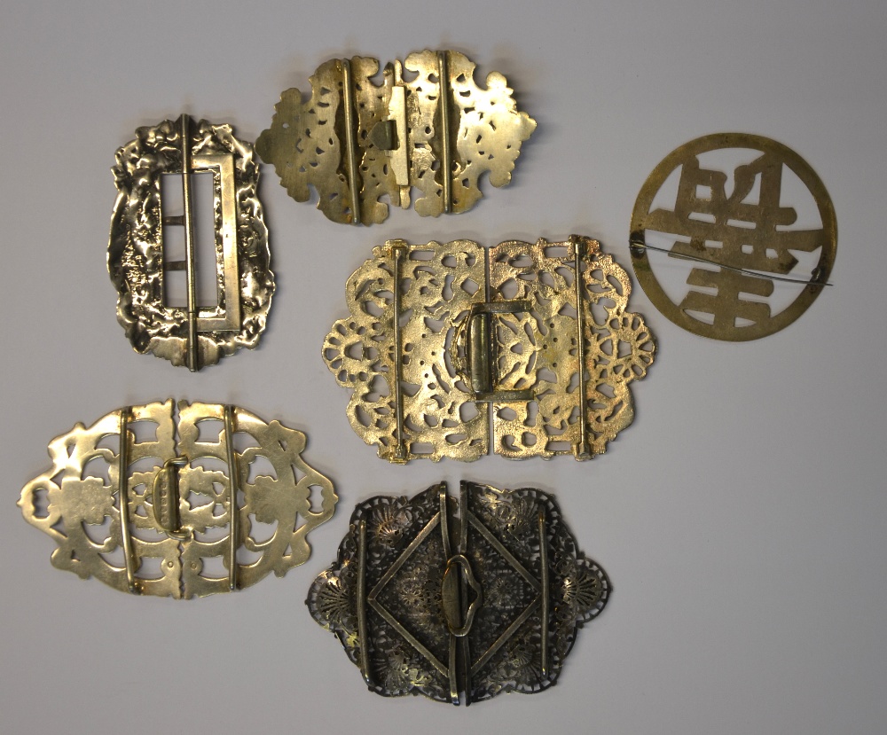 A collection of five ornate buckles to/w Chinese character brooch - Image 2 of 2