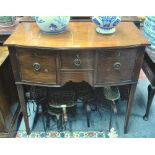 A diminutive Victorian bowfronted sideboard having an arrangement of drawers and cupboards and