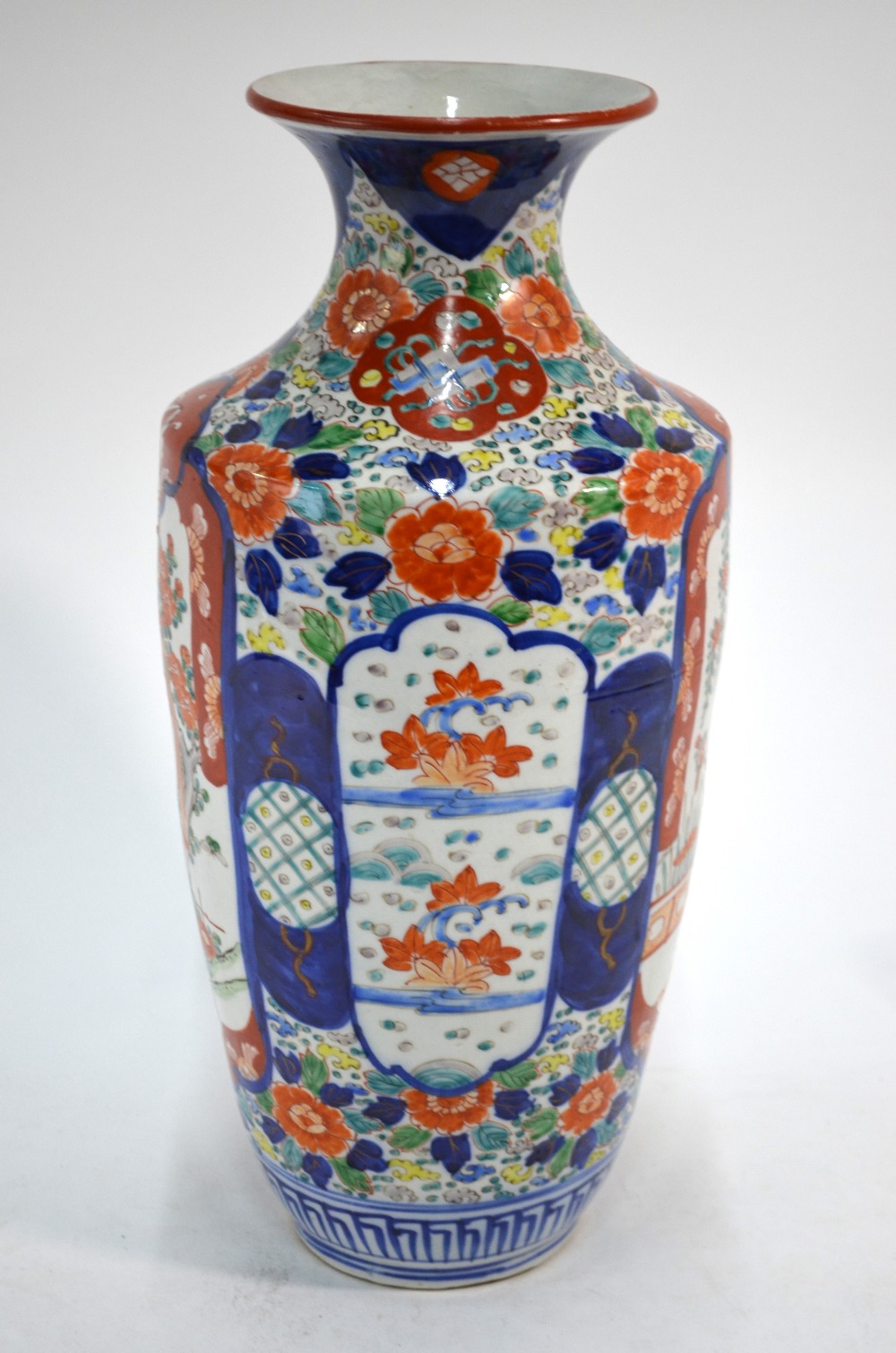 A Japanese Imari vase decorated in typical colours and green with one panel depicting a kacho-ga
