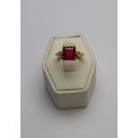 An oval ruby and eight cut diamond cluster ring,
