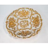 A Meissen scrolling and floral moulded bowl with gilded decoration,