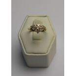 A diamond set triple cluster ring,