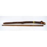 Two North West Native American Haida tribe sticks - red cedar totem pole and Thunderbird,