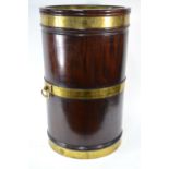 A substantial George III style oversize brass bound mahogany peat bucket,