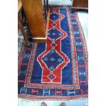 An old Anatolian rug, dark blue/red,