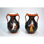 A pair of porcelain vases, twin loop handles, decorated in the Grecian style on a black ground,