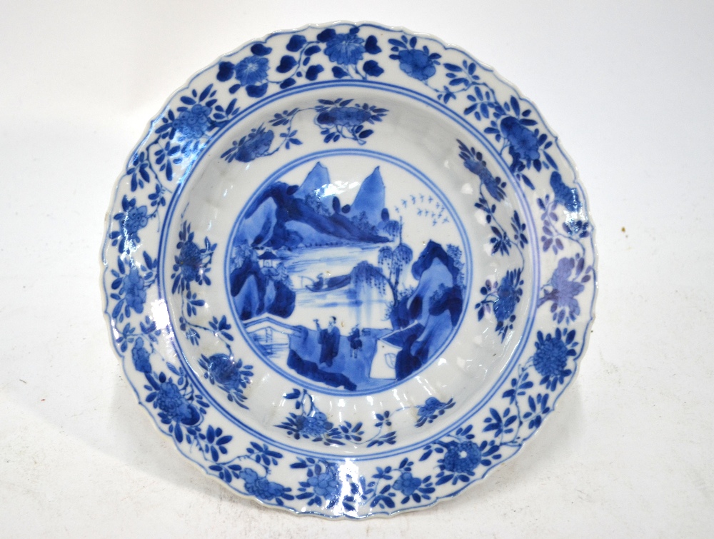 A Chinese blue and white dish with foliate rim,