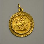 A 1931 gold sovereign in 9ct plain yellow metal mount,