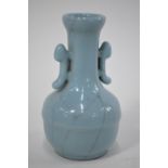 A Chinese small clair-de-lune (yueh pai style) vase with trumpet neck and pierced handles;