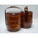An associated pair of circular and tiered boxes,