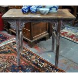 An antique provincial Chinese elm wood wine table, heavily patinated from use,