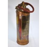 A vintage riveted copper Waterloo Fire Extinguisher, Type BD2, by Read & Campbell Ltd., Victoria St.
