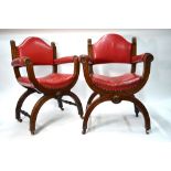 A pair of Victorian oak framed Glastonbury chairs with brass studded red leather seats (2)