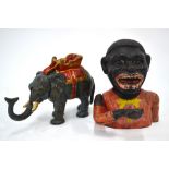 Two cold-painted cast iron novelty money boxes,